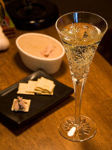 champagne with foie gras pate on crackers