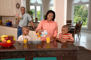 Family drinking juice at breakfast