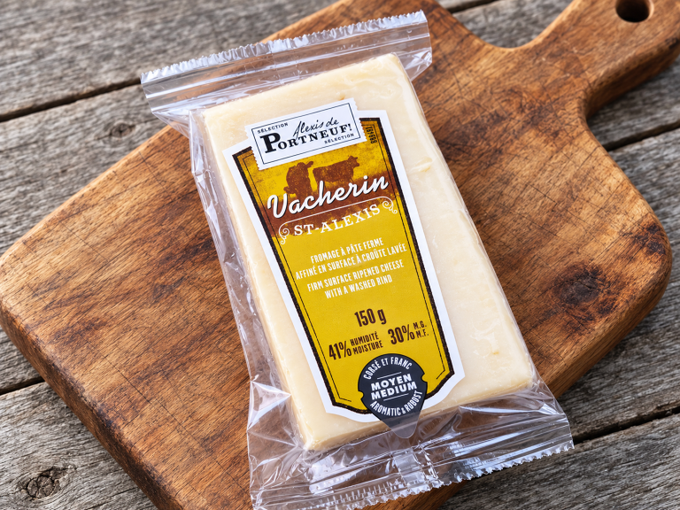 Alexis de Portneuf Vacherin St-Alexis cheese package on a wooden board
